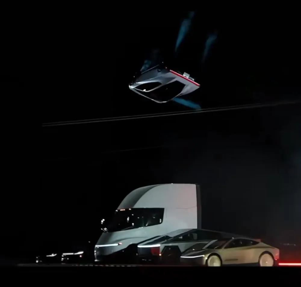 Véhicule retourné en l’air au-dessus d’un Semi, d’un Cybertruck et d’une voiture Tesla alignés de nuit